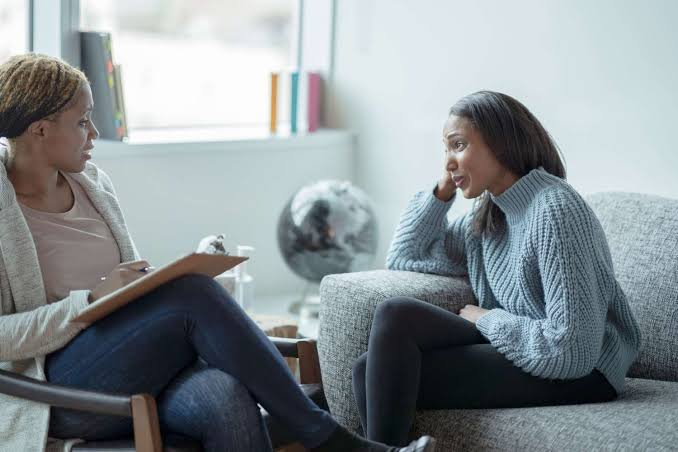 Psychologist leading a one-on-one therapy session with a client